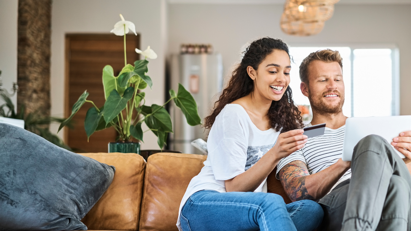 Happy Couple Loving their gift card for house cleaning.
